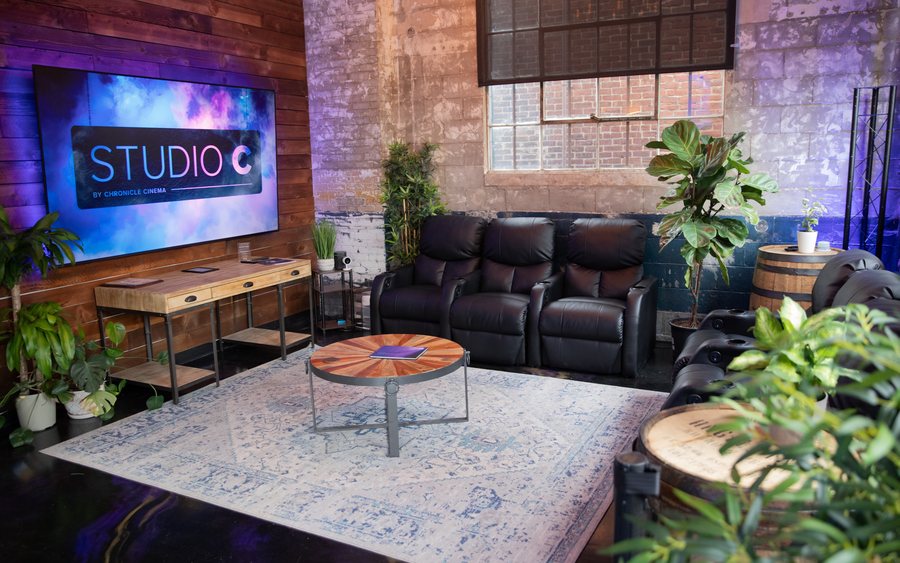 Main lobby with large tv and recliners at Studio C