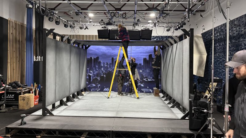 The Motionless in White corridor world glowing on the Studio C LED wall during filming