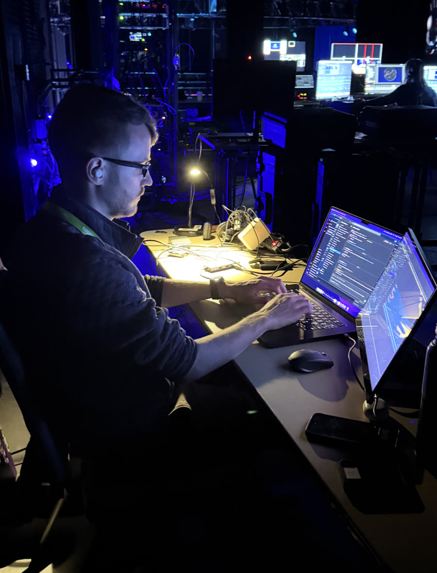 A Chronicle editor cutting content in the backstage edit bay in Las Vegas live at an event.
