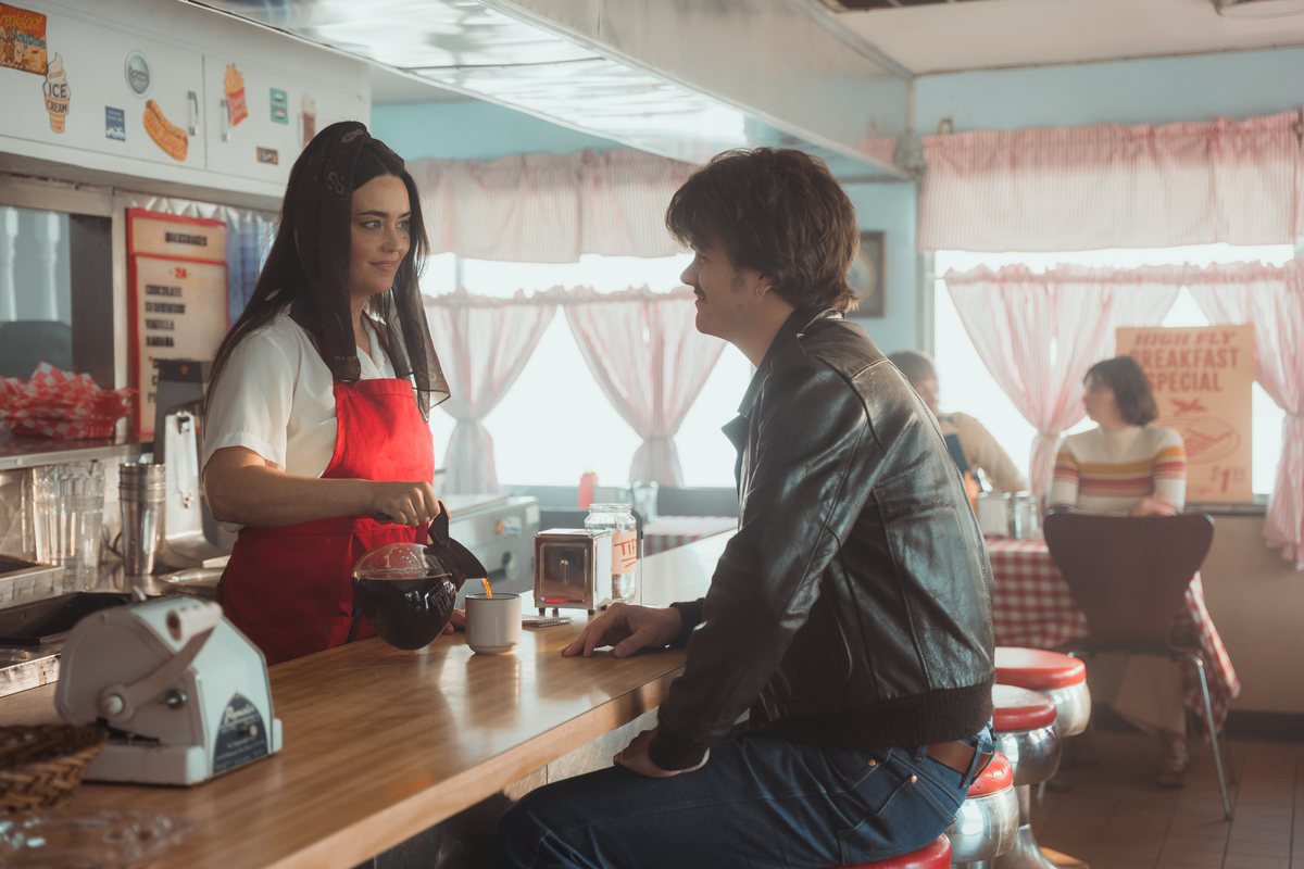 A waitress holds a coffee pot in the diner scene on the set of Free Bird.