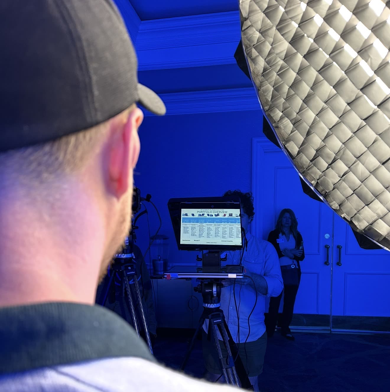 over the shoulder of Taylor Young as he looks into the teleprompter at the HP pop up roadshow studio.