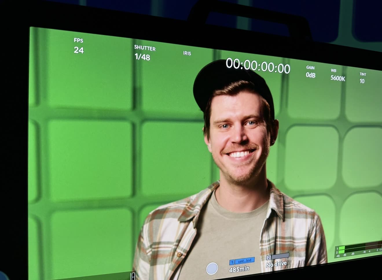 Behind the scenes at the HP roadshow pop-up studio as Taylor Young smiles into the camera.