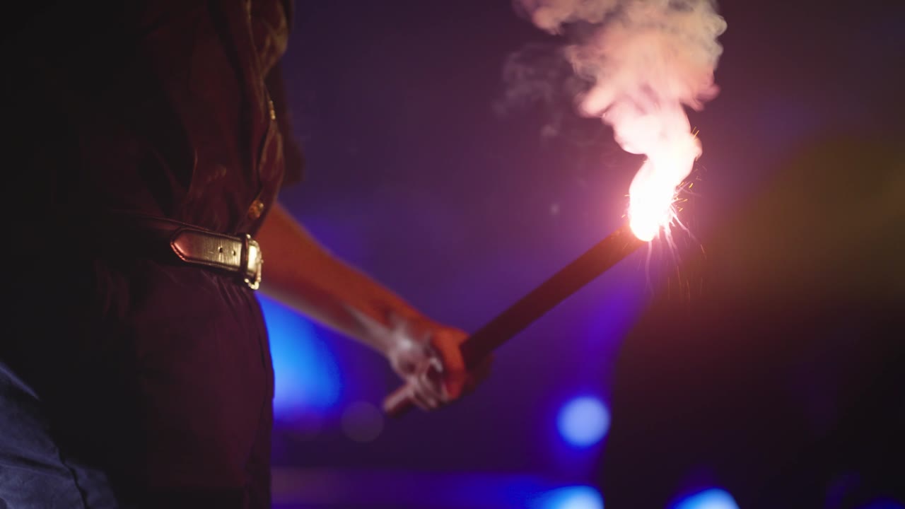A traffic flare ignites near a wrecked car in a scene from the Isaacs & Isaacs “Are You Okay?” TV campaign, shot at Studio C.