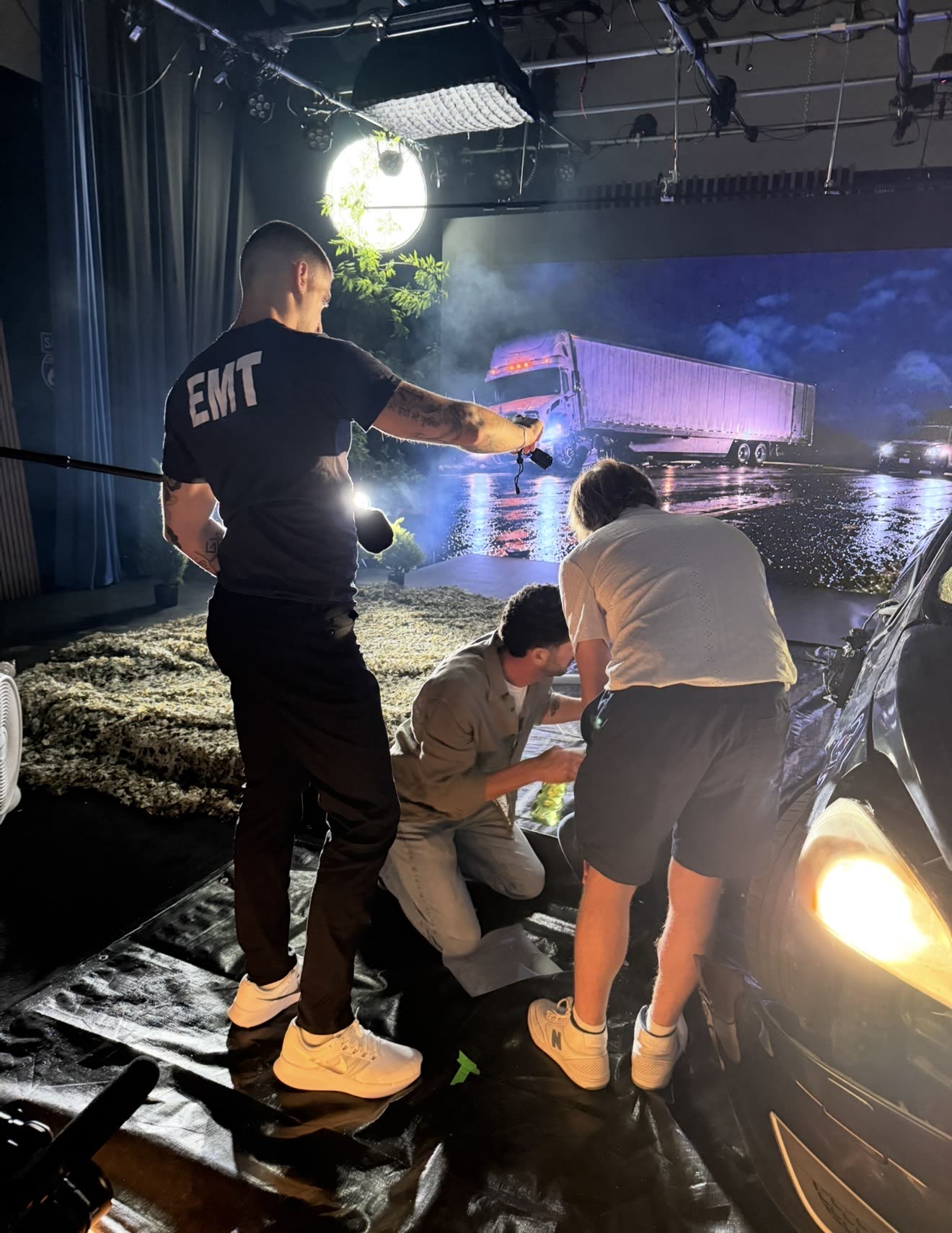 A car wreck scene in front of the LED wall at the Isaacs & Isaacs "Are You Okay" shoot.