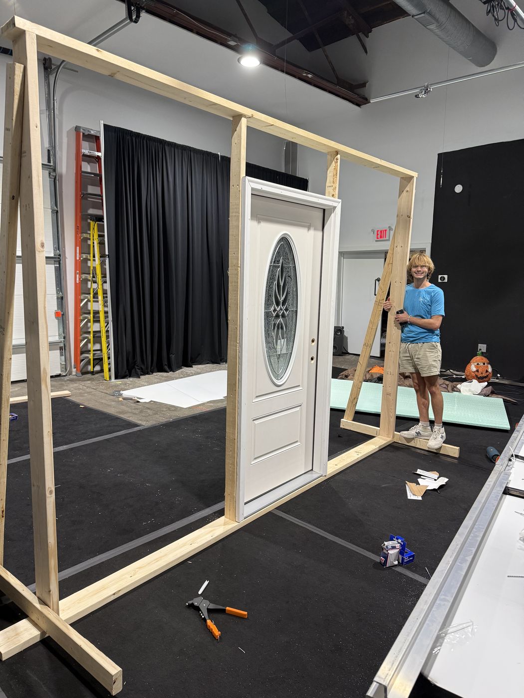 Framing the practical front door build on the rotating stage at Studio C.
