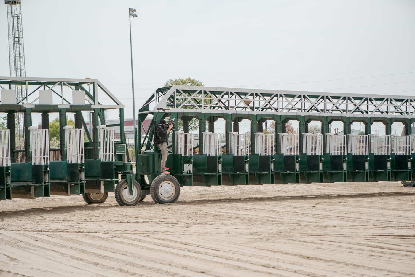 Behind the scenes on the Woodford Reserve shoot as a camera operator films the starting gate.